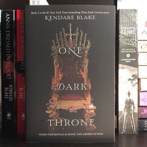 Paperback “One Dark Throne” by Kendare Blake